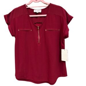 Sweet Wanderer dark red blouse with zipper v-neck.